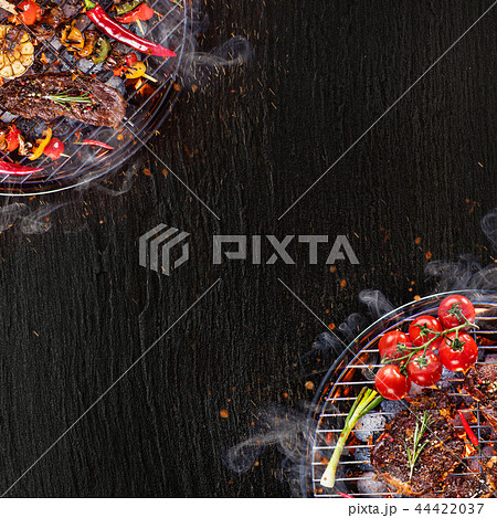 Barbecue grill with beef steaks, close-up. Barbecue grill with beef steaks, close-up. 44422037