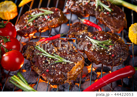 Barbecue grill with beef steaks, close-up. 44422053