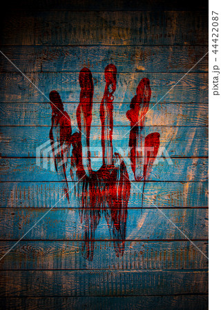 Bloody fingerprint on old wooden background. Bloody fingerprint on old wooden background. 44422087