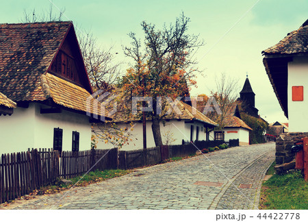 Landscape of Holloko with wooden church Landscape of Holloko with wooden church 44422778