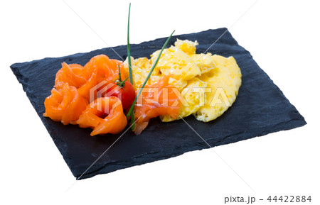 Traditional dish of Norwegian cuisine of omelet with salmon at plate Traditional dish of Norwegian cuisine of omelet with salmon at plate 44422884