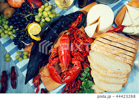 Still life with cooking seafood products, wine and cheese Still life with cooking seafood products, wine and cheese 44423268