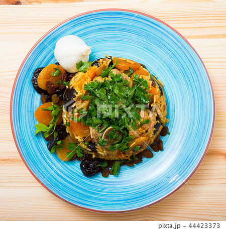 Top view of pilaf from lamb with dried apricots, prunes Top view of pilaf from lamb with dried apricots, prunes 44423373