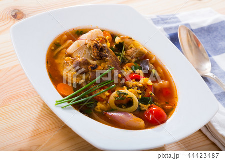 Lamb's soup cooked with rice, vegetables, onion and garlic 44423487