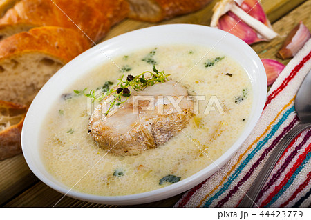 Creamy haddock soup with herbs 44423779