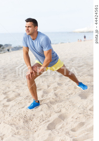 Man training on beach 44424561