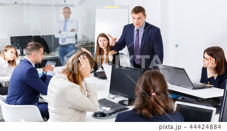 Businessman feeling angry to coworkers in office, pointing out mistakes in work 44424884