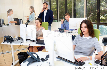 Group of successful business people during daily work in modern co-working space 44425374