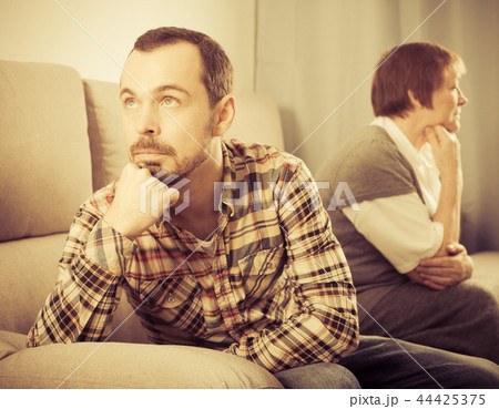 Elderly mother and son quarrel 44425375