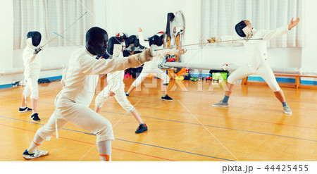 adults and teenagers athletes at fencing workout adults and teenagers athletes at fencing workout 44425455