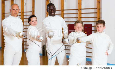 Portrait of cheerful mixed age group of athletes 44426003