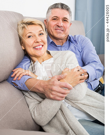 satisfied mature married couple in house are warmly reconciled after quarrel satisfied mature married couple in house are warmly reconciled after quarrel 44426005