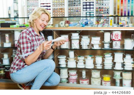 Woman choosing decorative band Woman choosing decorative band 44426680
