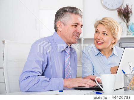 Colleagues discussing project Colleagues discussing project 44426783