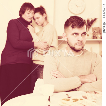 Upset man having problems in relationship with family 44426784