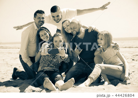 Friends making selfie at sandy beach 44426804