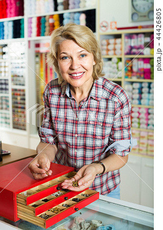 mature woman customer in sewing store. 44426805