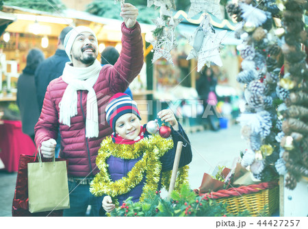 Little girl with dad buying decorations for Xmas 44427257