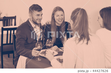 Gentleman with elegant women are having dinner in luxury restaurante 44427626