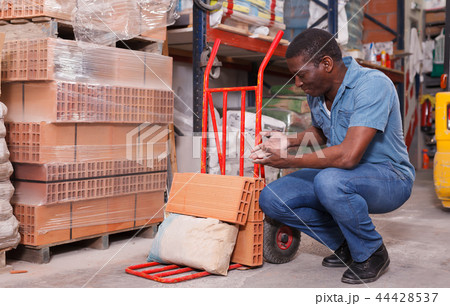 Adult African-American man with handbarrow 44428537