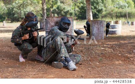 Paintball players of opposite teams in shootout 44428538