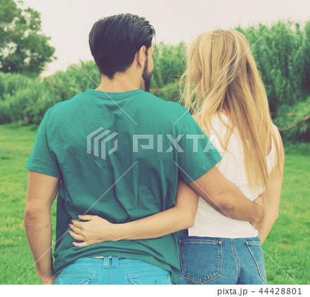 Smiling couple is walking together 44428801