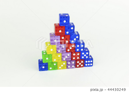 Colorful pyramid of neatly stacked game dice Colorful pyramid of neatly stacked game dice 44430249