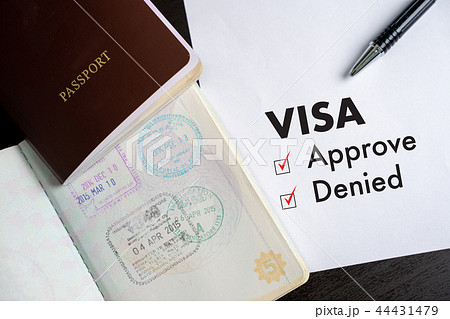 Visa and passport to approved stamped on a 44431479