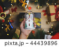 Hand Holding Christmas Glass Ornament 44439896