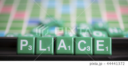 letter green scrabble is spelling word PLACE. letter green scrabble is spelling word PLACE. 44441372