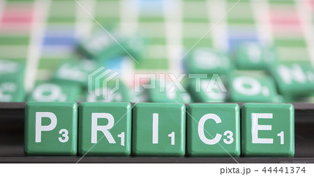 letter green scrabble is spelling word PRICE. letter green scrabble is spelling word PRICE. 44441374