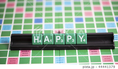 letter green scrabble is spelling word HAPPY. letter green scrabble is spelling word HAPPY. 44441379