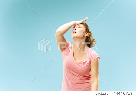 Woman having headache. Isolated over pastel background. Woman having headache. Isolated over pastel background. 44446713