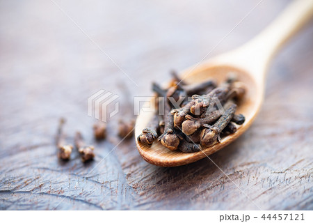 Dried cloves on wooden spoon, herb and spice Dried cloves on wooden spoon, herb and spice 44457121