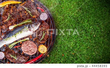 Barbecue grill with sea fishe, close-up. Barbecue grill with sea fishe, close-up. 44458393