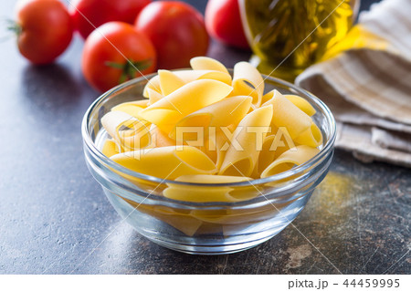 Uncooked penne pasta. 44459995