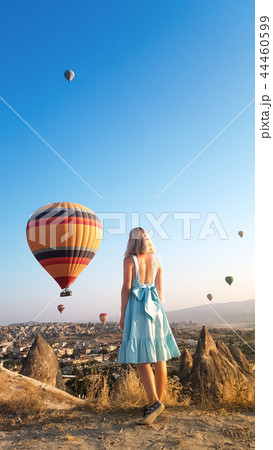 Woman watching like colorful hot air balloons. 44460599