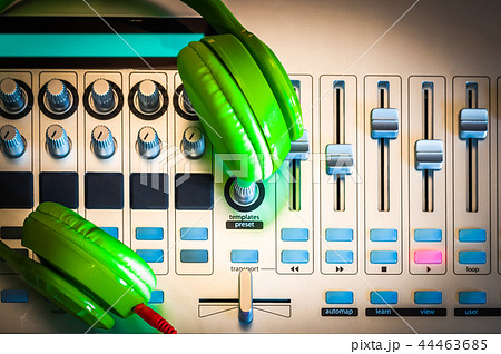 green headphone on digital sound mixer green headphone on digital sound mixer 44463685