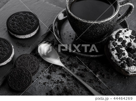 Black coffee cup with saucer and doughnut Black coffee cup with saucer and doughnut 44464269