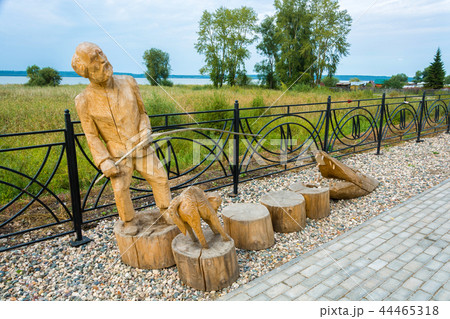Wooden sculpture of a fisherman on the embankment Wooden sculpture of a fisherman on the embankment 44465318