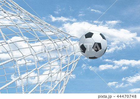 3d rendering of a football ball flying away from inside the gate net and tearing it. 44470748