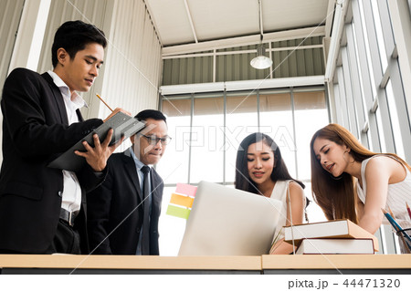 Asian Businesspeople brainstorming while meeting. 44471320