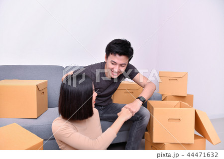 Moving house Concept. Asian young man is carrying his belongings Moving house Concept. Asian young man is carrying his belongings 44471632