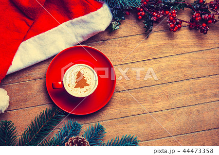 red cup of Cappuccino and Christmas ha red cup of Cappuccino and Christmas ha 44473358
