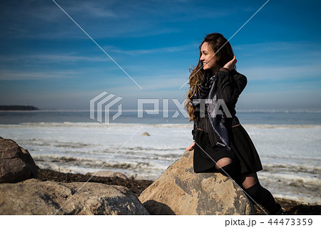 Young beautiful woman in elegant clothes with scarf Young beautiful woman in elegant clothes with scarf 44473359