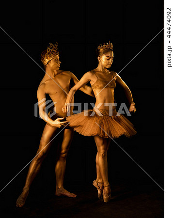 Professional, emotional ballet dancers with crowns on dark smoke scene performed by sexual couple Professional, emotional ballet dancers with crowns on dark smoke scene performed by sexual couple 44474092