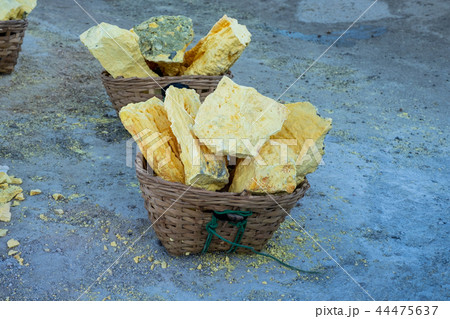 Yellow Sulphur cracked piece on wooden basket 44475637