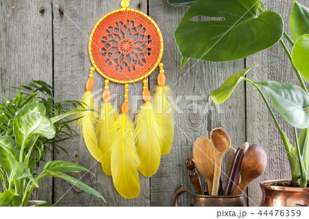 Orange yellow dream catcher on gray 44476359