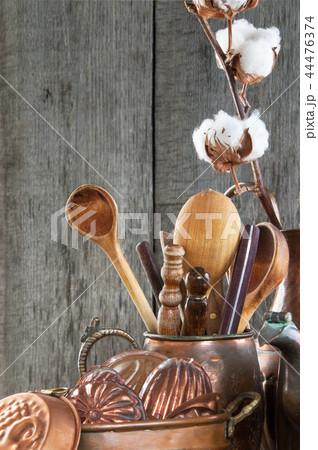 Vintage copper kitchen utensils on blue background Vintage copper kitchen utensils on blue background 44476374