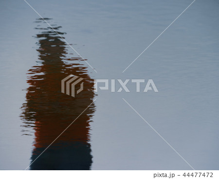 Reflections of man in the Water 44477472